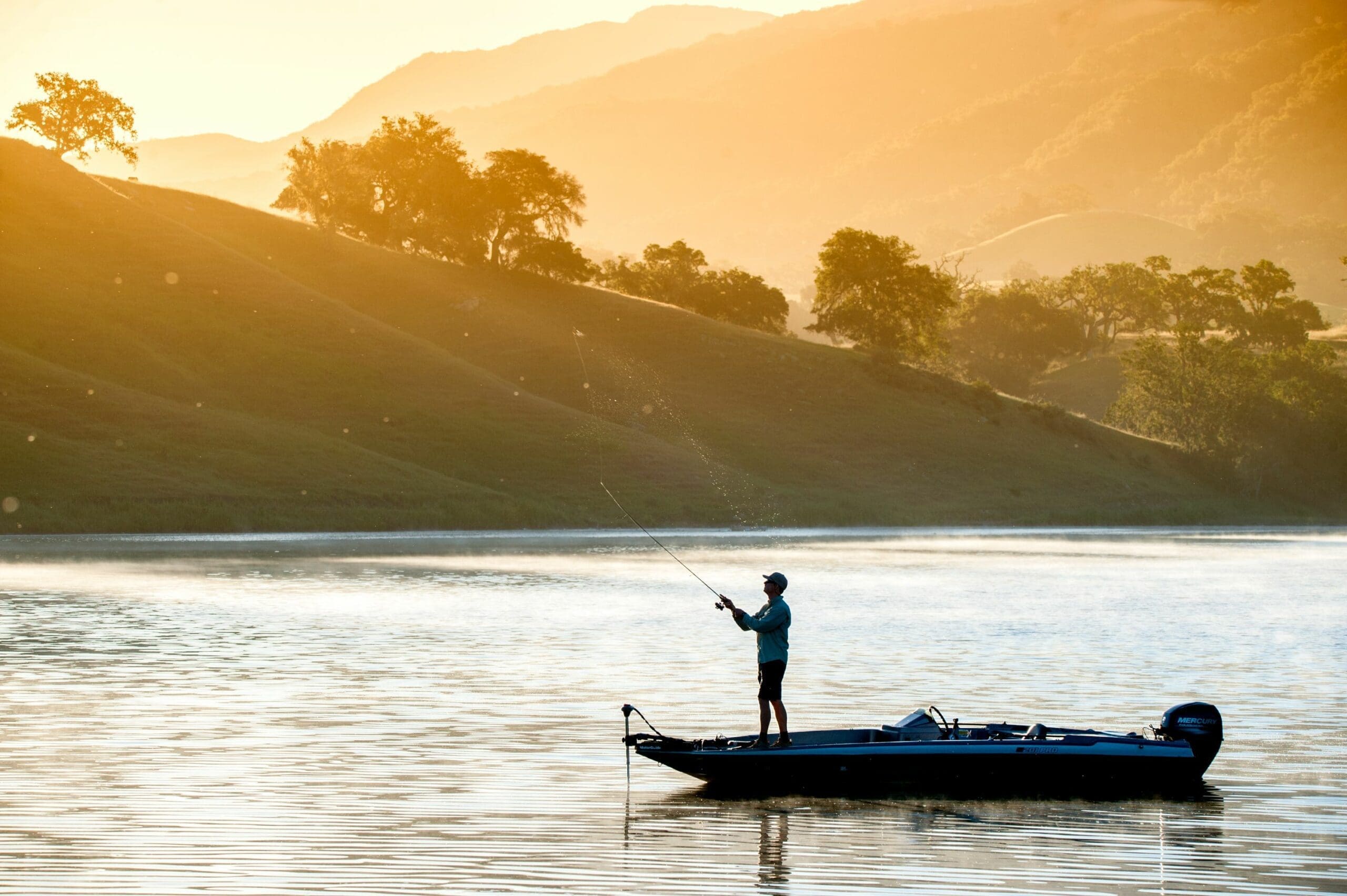 view of person fishing from boat on a lake