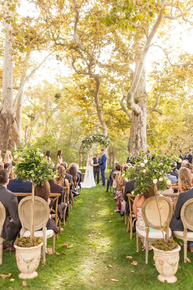 Bride and groom getting married in front of family at Alisal Ranch