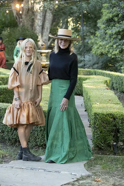two people wearing Designer Heidi Merrick's RNCH Collection