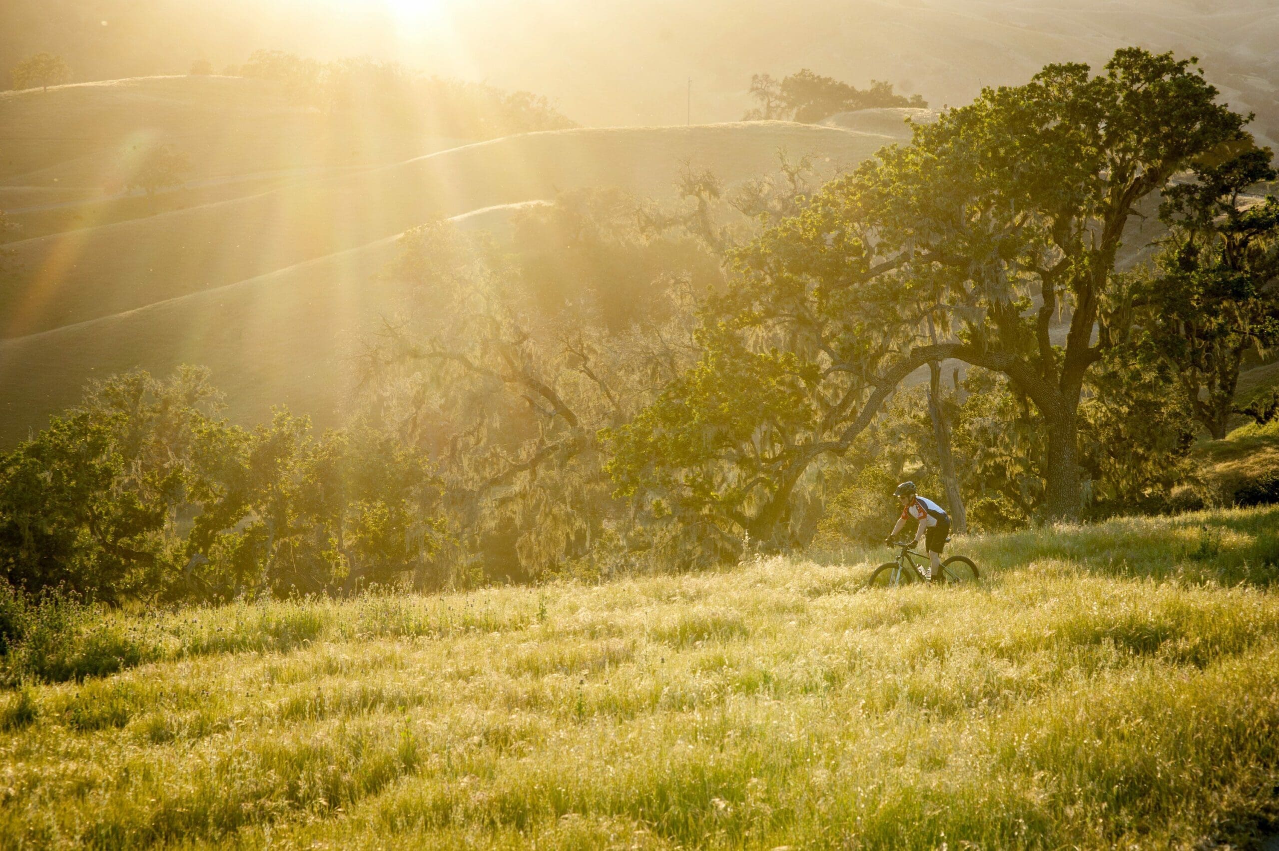 person riding e-bike along the hills