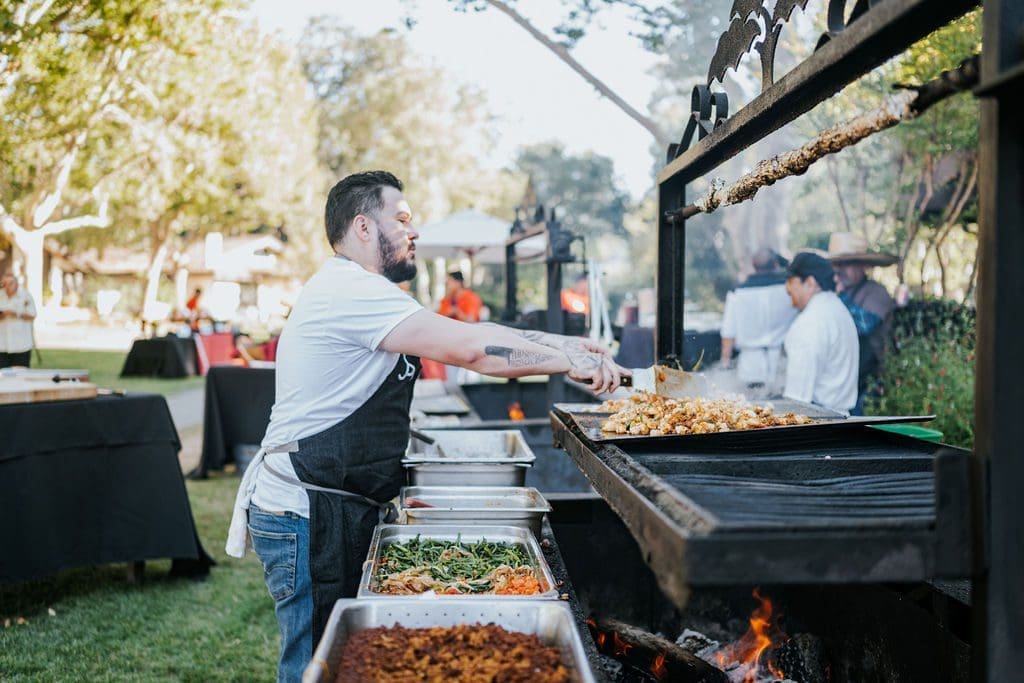 person grilling food outside