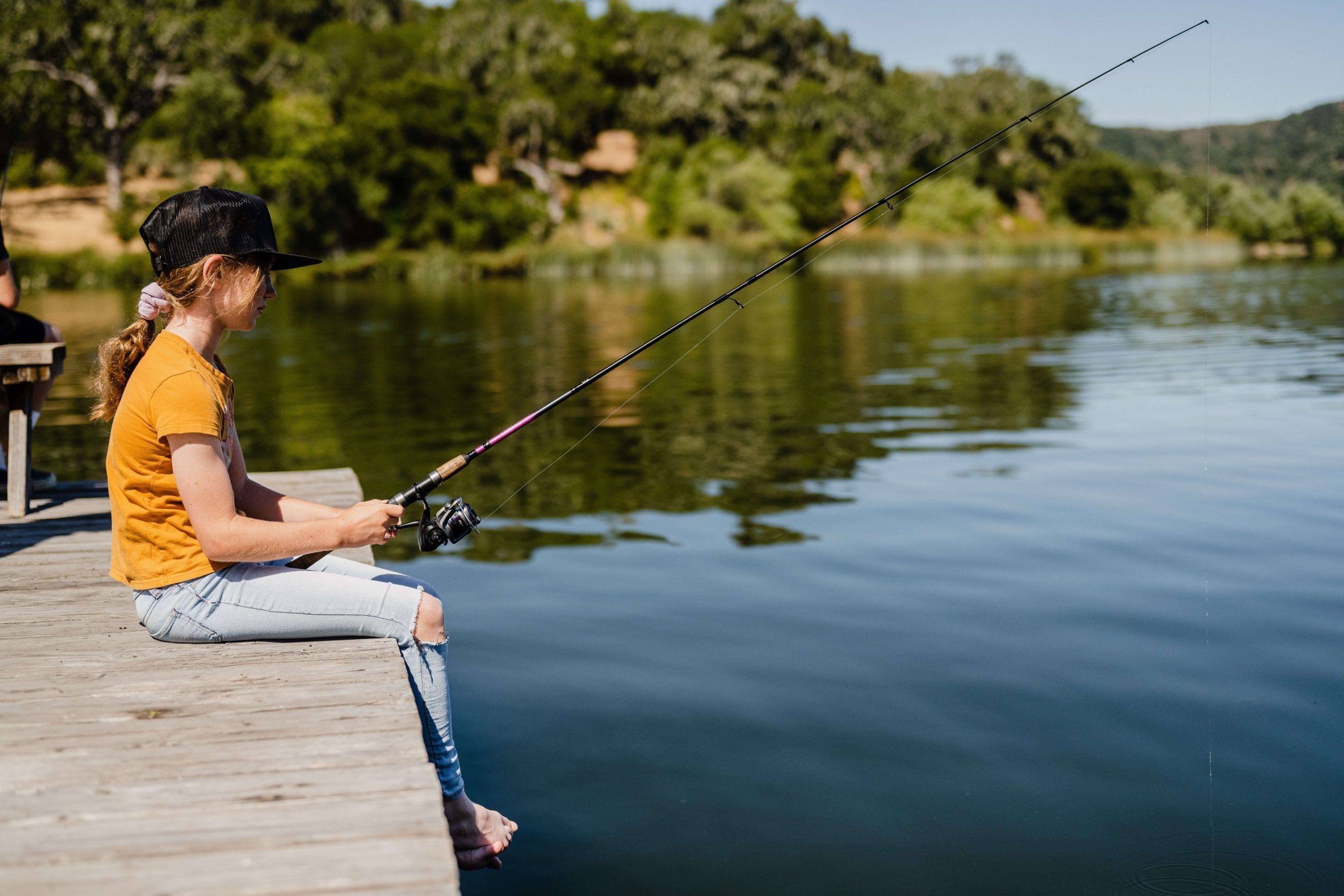person fishing from the dock