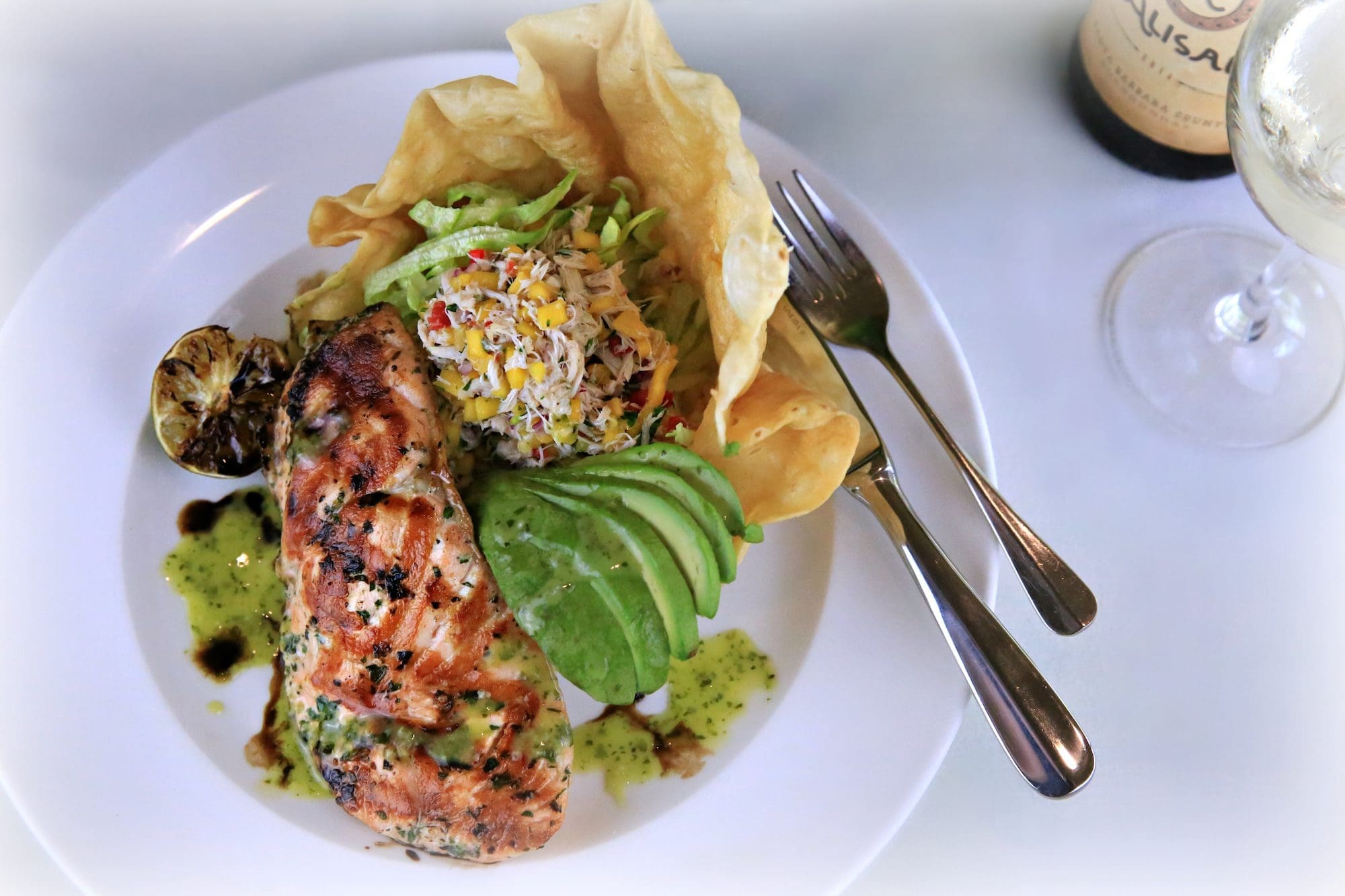 grilled salmon and food on a plate