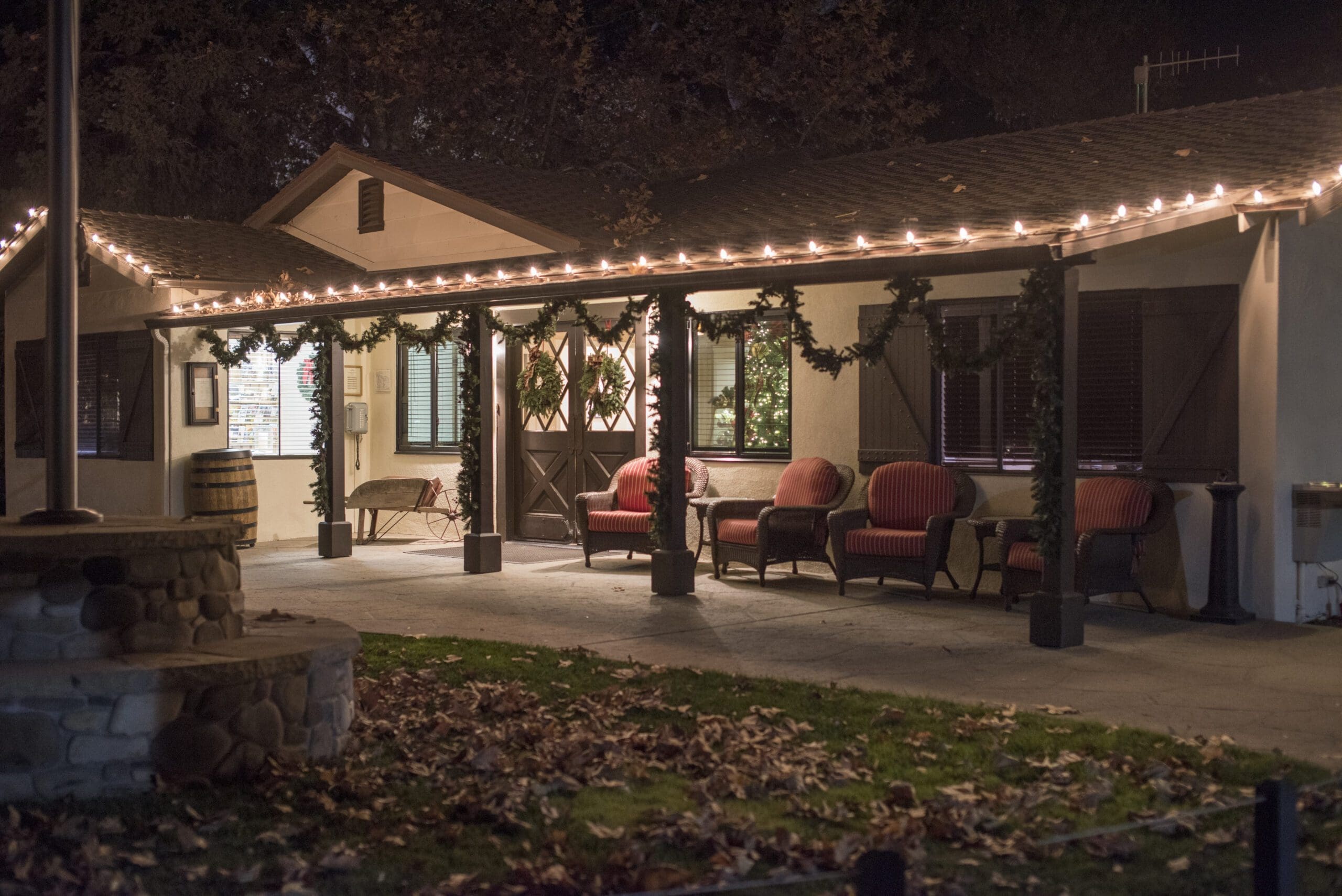 building exterior at night with handing lights