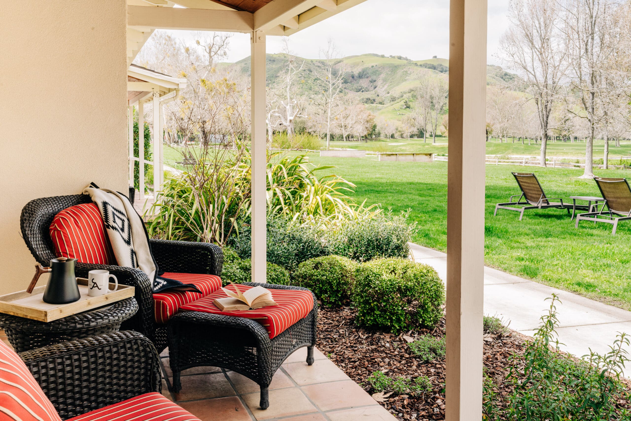 outdoor patio at Alisal Ranch with tea and reading book for Accommodations at Alisal Ranch